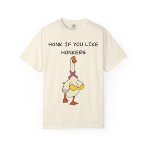 Graphic tee with a cartoon goose wearing a human-like yellow bikini and a Breast Cancer Awareness pink ribbon as a scarf with the words: "honk if you like honkers" above. Front view, color tan.